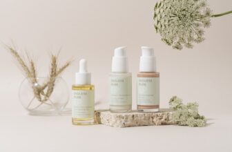 A serene skincare setup featuring gentle products like creams and serums, with calming elements such as plants or soft lighting.
