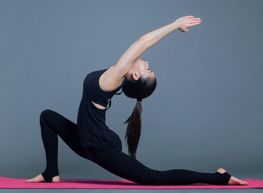 A person practicing good posture while sitting at a desk, with a focus on ergonomic setup and body alignment.