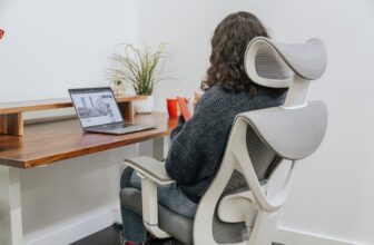 A comfortable ergonomic workspace setup with a keyboard, mouse, and wrist support, showcasing a healthy working environment.