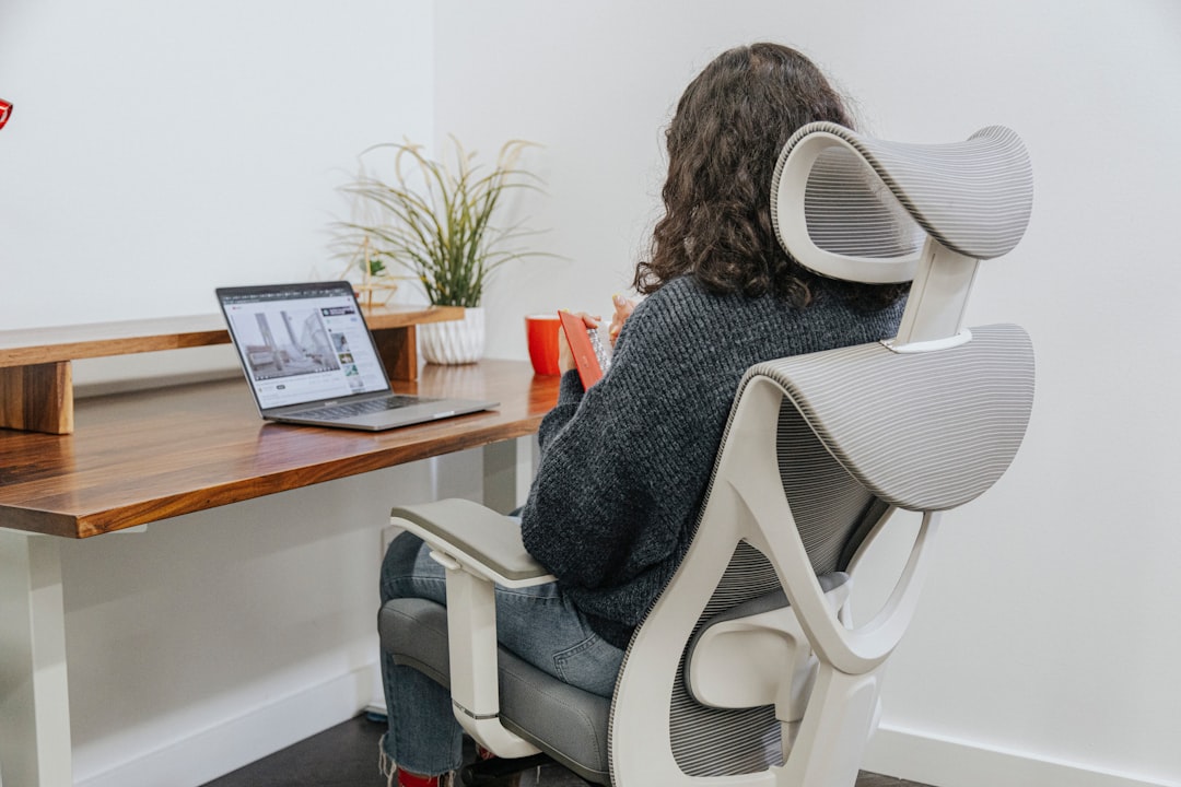A comfortable ergonomic workspace setup with a keyboard, mouse, and wrist support, showcasing a healthy working environment.