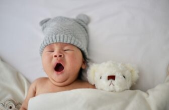 A peaceful nursery with a crib, soft lighting, and calming decor, creating a safe and comfortable environment for a baby to sleep.