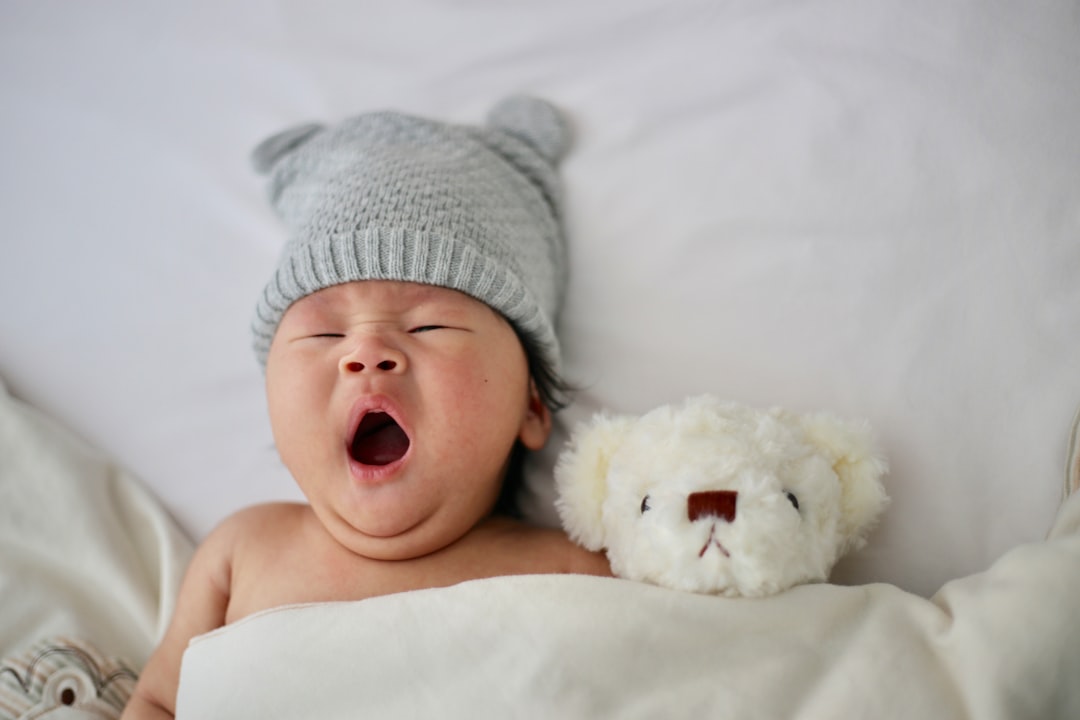 A peaceful nursery with a crib, soft lighting, and calming decor, creating a safe and comfortable environment for a baby to sleep.